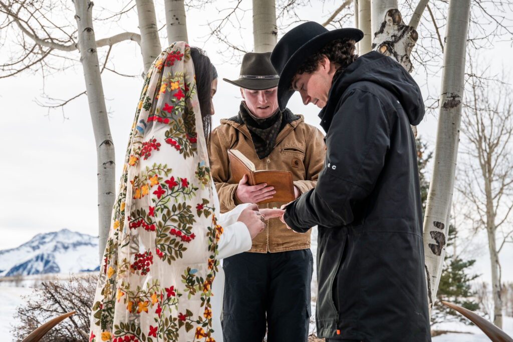 Bride and groom with officiant in Telluride, Colorado wedding 